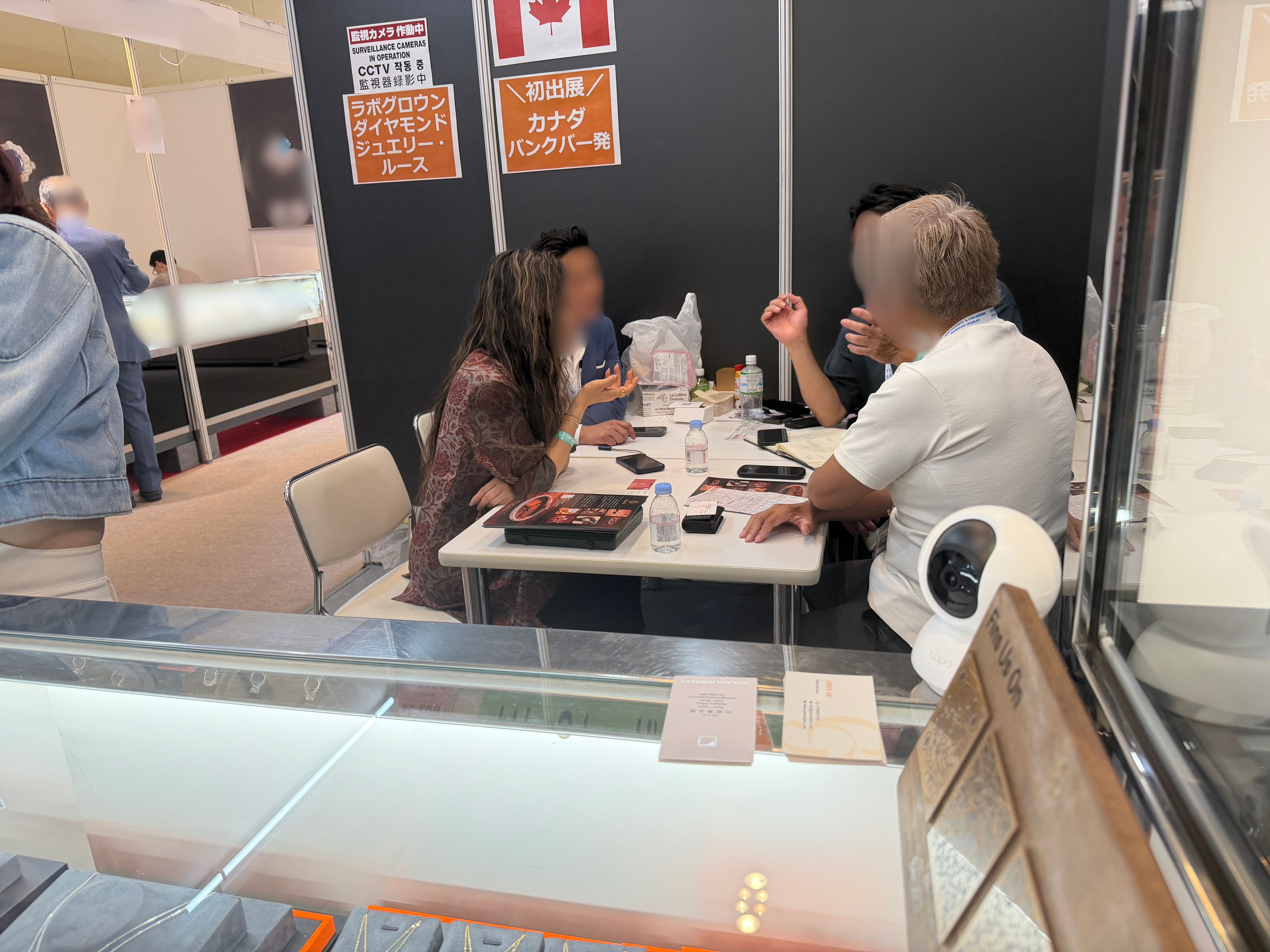 Gwen’s Glow Jewelry Inc. customer meeting at the exhibition booth